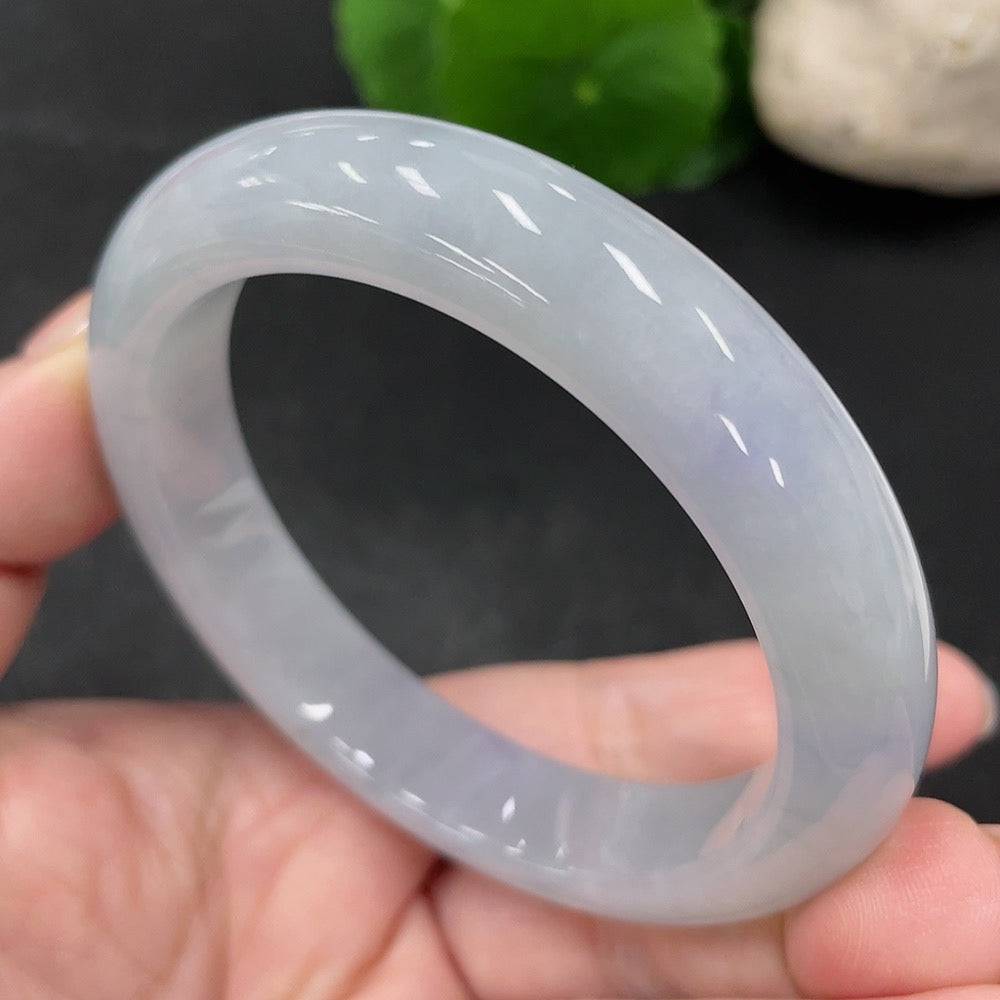 Jadeite round bangle in size 55.7 with a total weight of 57.52g, crafted by HUILIU HQ, showcasing smooth, polished jade surface.