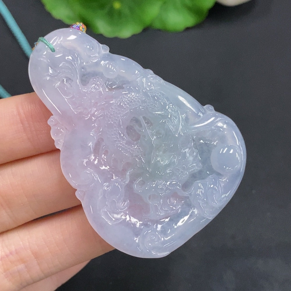 Huiliu Jadeite Dragon pendant with soaring dragon design, crafted from green jade, symbolizing strength and good fortune.