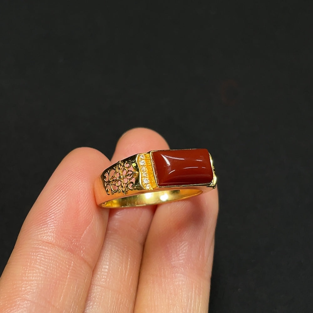 18K gold agate ring by HKHQ featuring a polished, colorful agate gemstone set in a sleek gold band.