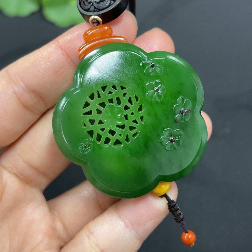 HUILIU HQ Hetian jade jasper pendant featuring intricate flower and wealth symbols, showcasing vibrant green and brown tones.