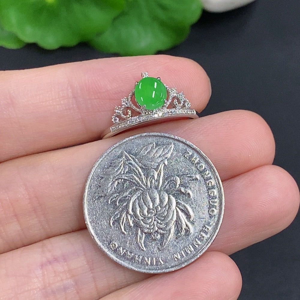 Jadeite cabochon ring with diamond accents in 18k gold, size 15, weighing approx. 1.7g, featuring a smooth green jade gemstone.