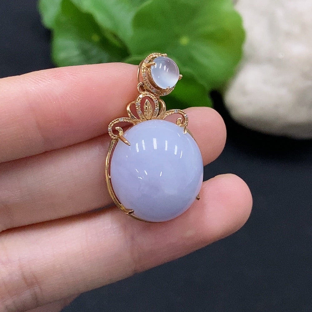 Jadeite cabochon pendant set in 18K gold with diamond accents, featuring a polished green jade pendant and matching chain.