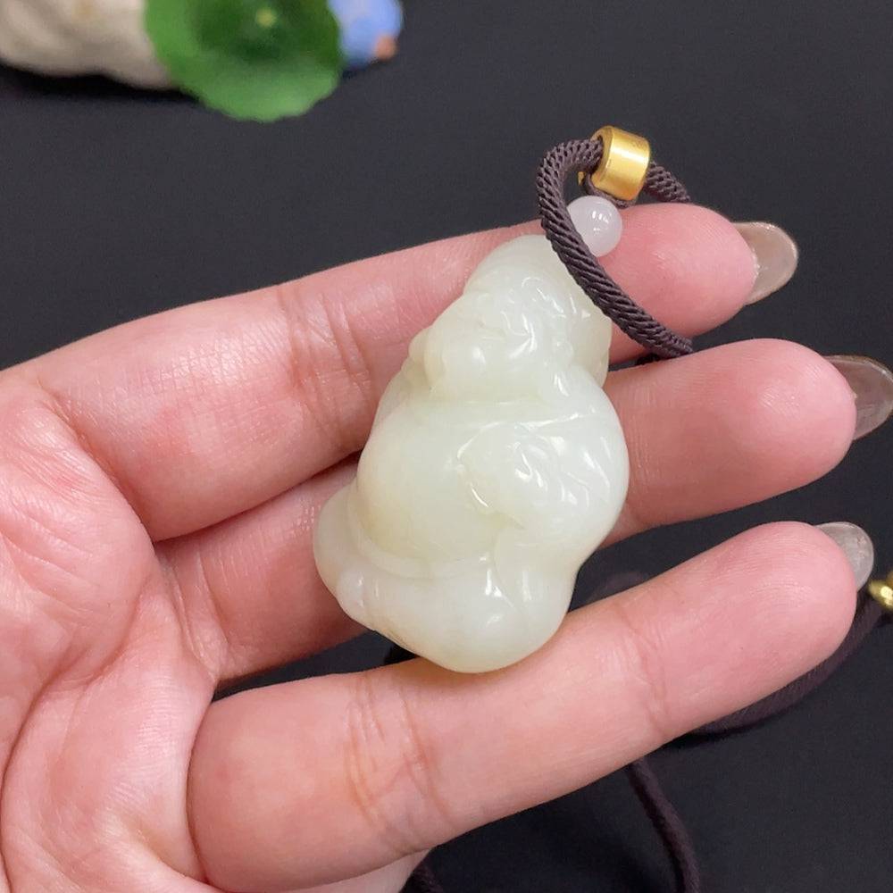 Hetian jade pendant featuring the God of Wealth, weighing approx. 34.8g, crafted from high-quality jade with a rope.