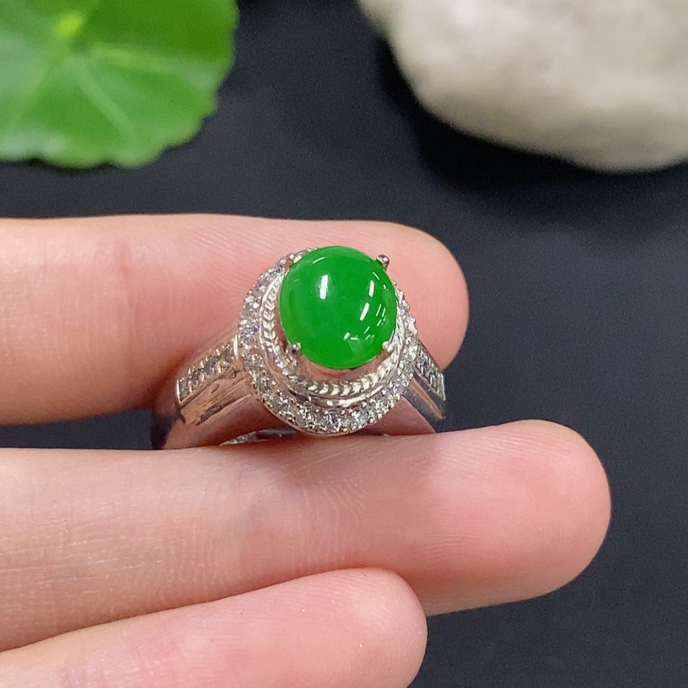 Jadeite cabochon jewelry set in a non-gold metal setting, featuring a smooth, polished green gemstone in a stylish design.