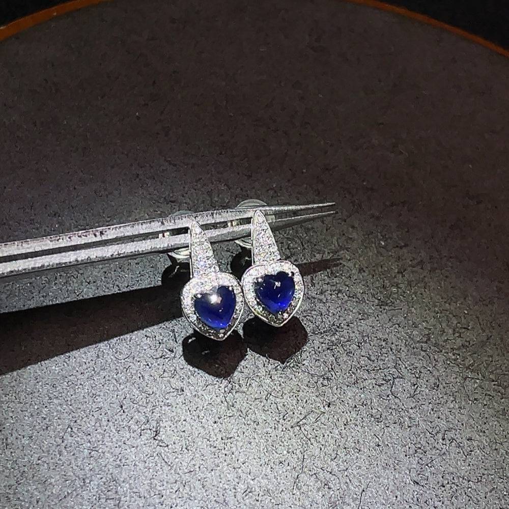 Huiliu Sapphire earrings with diamond accents, showcasing vibrant blue sapphires and sparkling diamonds in a elegant gemstone jewelry design.