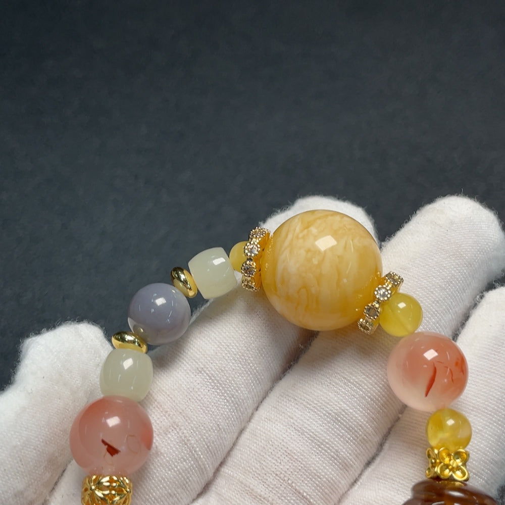 Huiliu Amber bracelet featuring red agate and Hetian jade beads, 21.2mm, showcasing warm amber tones and vibrant gemstone accents.