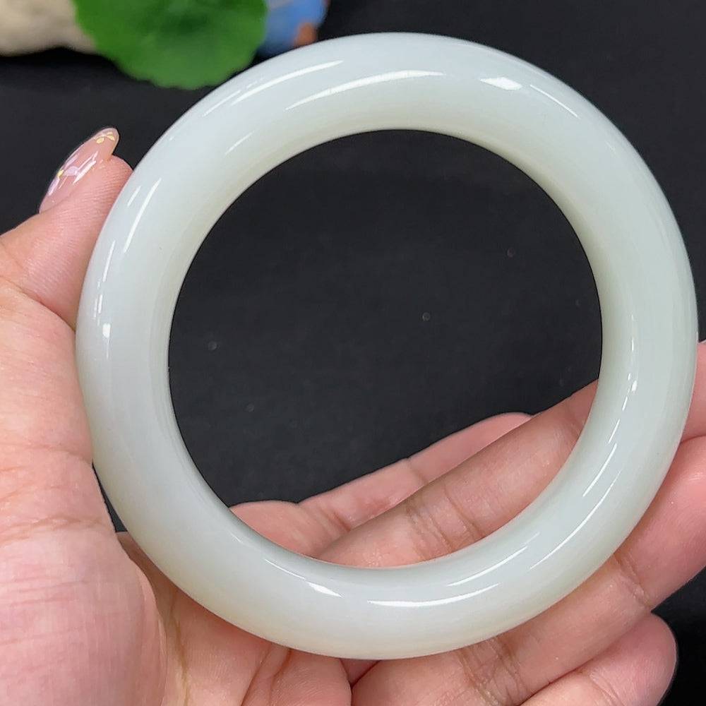 Huiliu certified Hetian jade round bracelet featuring smooth, polished green jade beads on a delicate string.