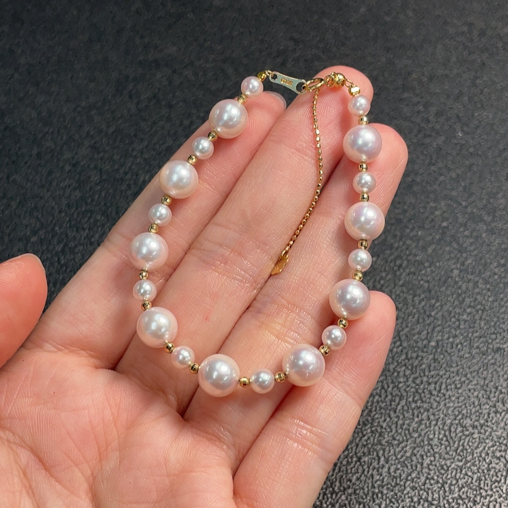 HUILIU HQ seawater pearl bracelet with red-marked beads, 18k gold clasp, 4.3-7.2mm pearls, approximately 7.24g weight.
