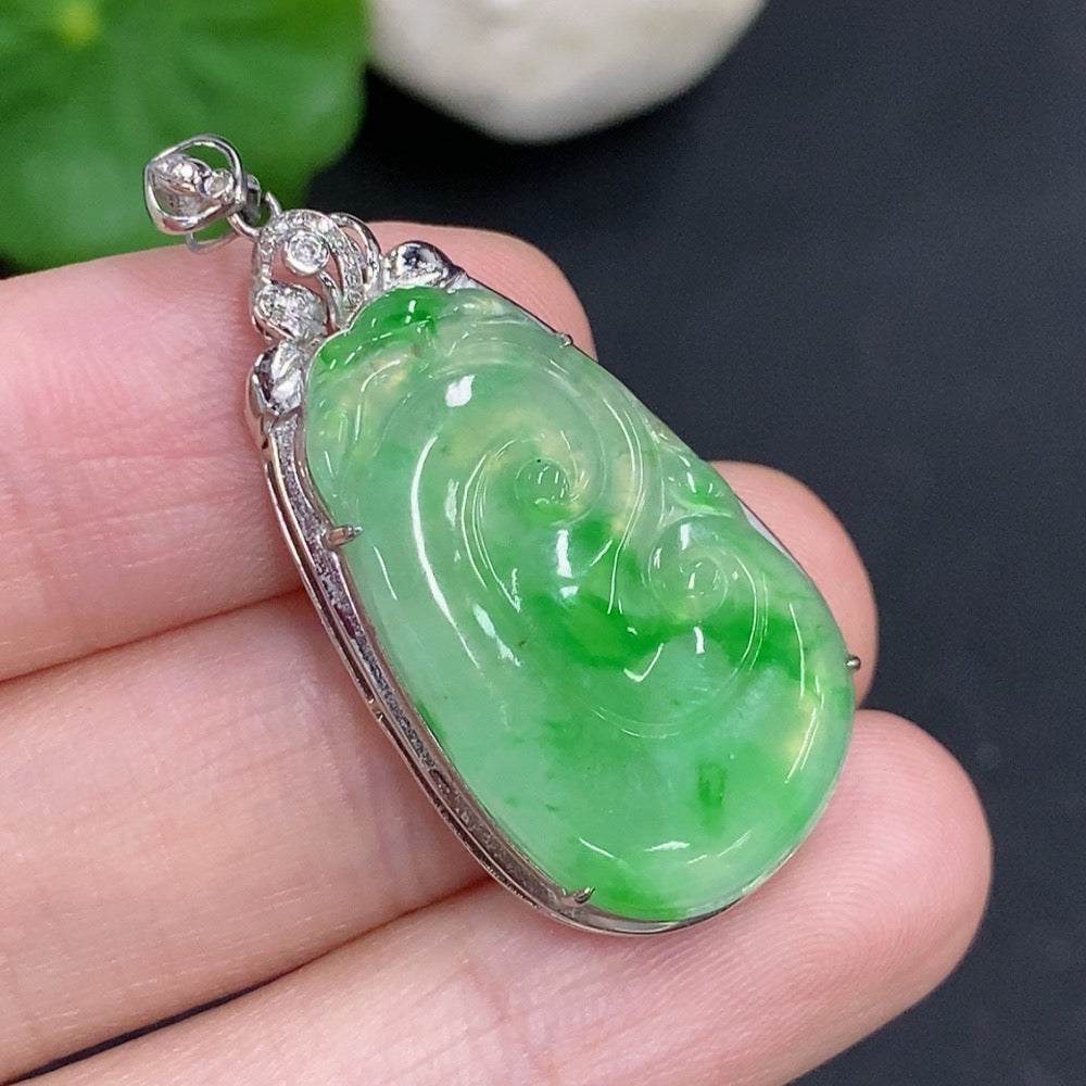 Jadeite Ruyi pendant with 18K gold and diamond accents, shown in close-up on a neutral background.