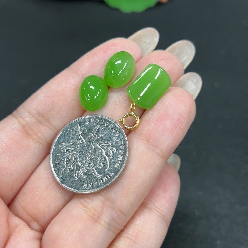 HKHQ Hetian Jade inlaid earrings featuring 18K gold design with elegant pendant and matching earrings, showcasing intricate craftsmanship.