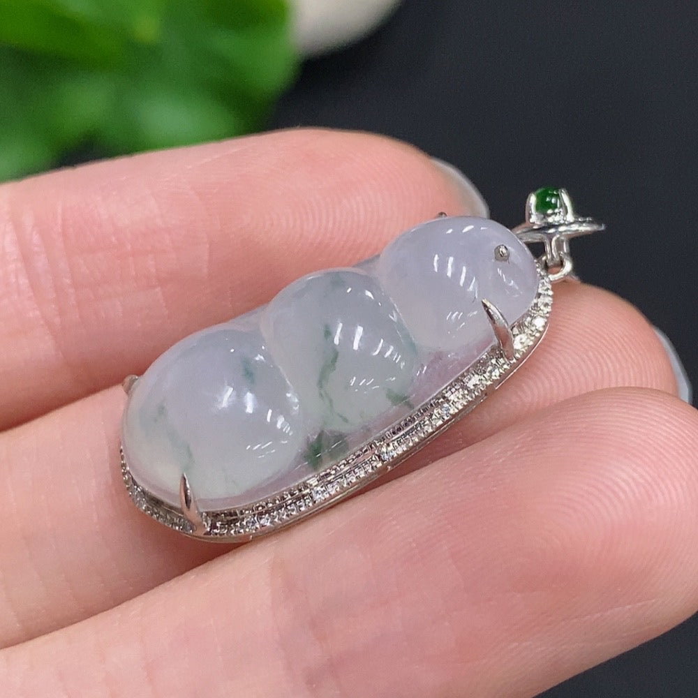 Jadeite lucky bean pendant by HUILIU HQ with 18k gold and diamond accents, weighing approximately 3.63 grams.