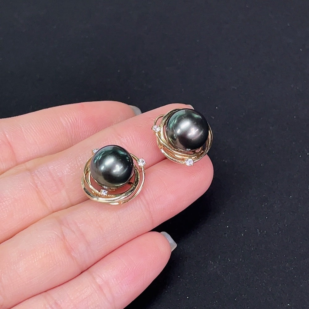 Saltwater pearl stud earrings in 14K gold by HKHQ, featuring elegant round pearls with a classic jewelry design.