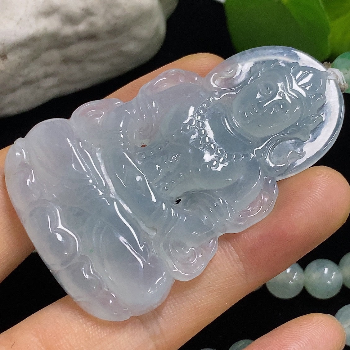 Jadeite Tara pendant from HKHQ featuring a detailed green jade pendant on a silver chain.