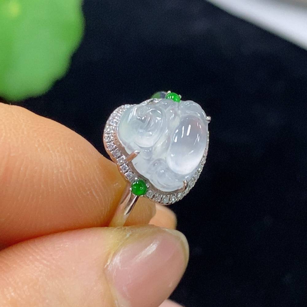 Huiliu Jadeite ring set with diamond accents, featuring polished green jade and sparkling diamond details on a silver band.