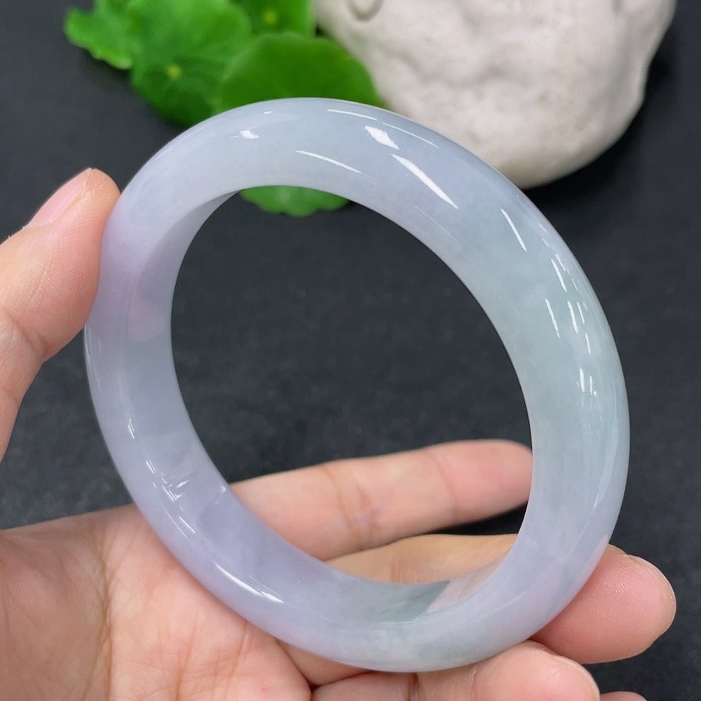 HKHQ jadeite round bangle bracelet in size 56.5 with 63.79g, showcasing smooth, polished jadeite in a classic round shape.