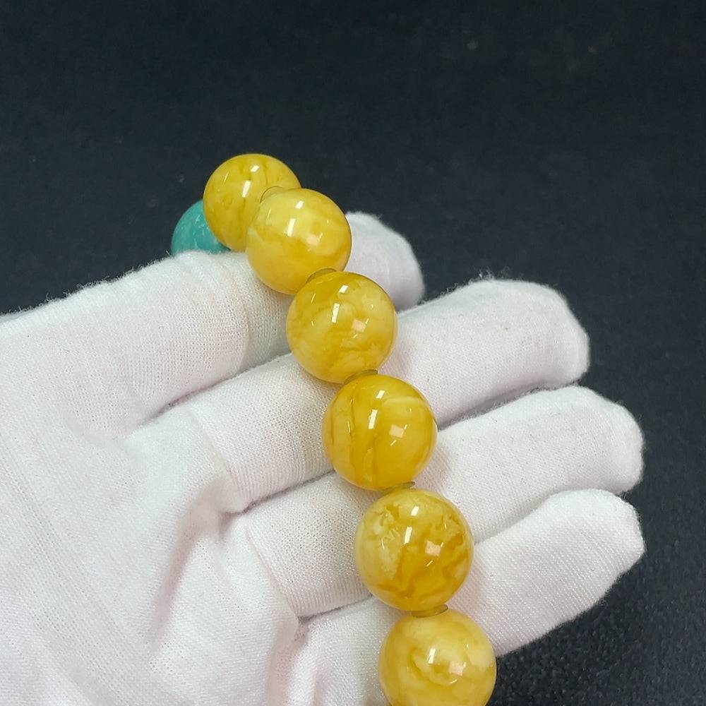 Amber beeswax bracelet by HUILIU HQ featuring natural amber beads with non-natural accent stones, 16.2mm size, weighs approximately 40.13g.