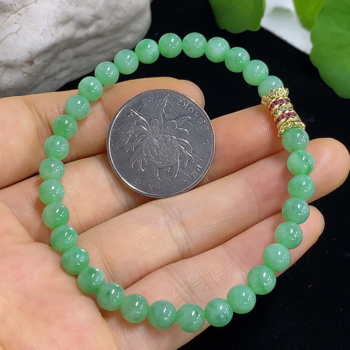Jadeite bracelet with 5.6mm jade beads, non-gold, weighing approximately 11.96g, featuring smooth, polished jade stones.