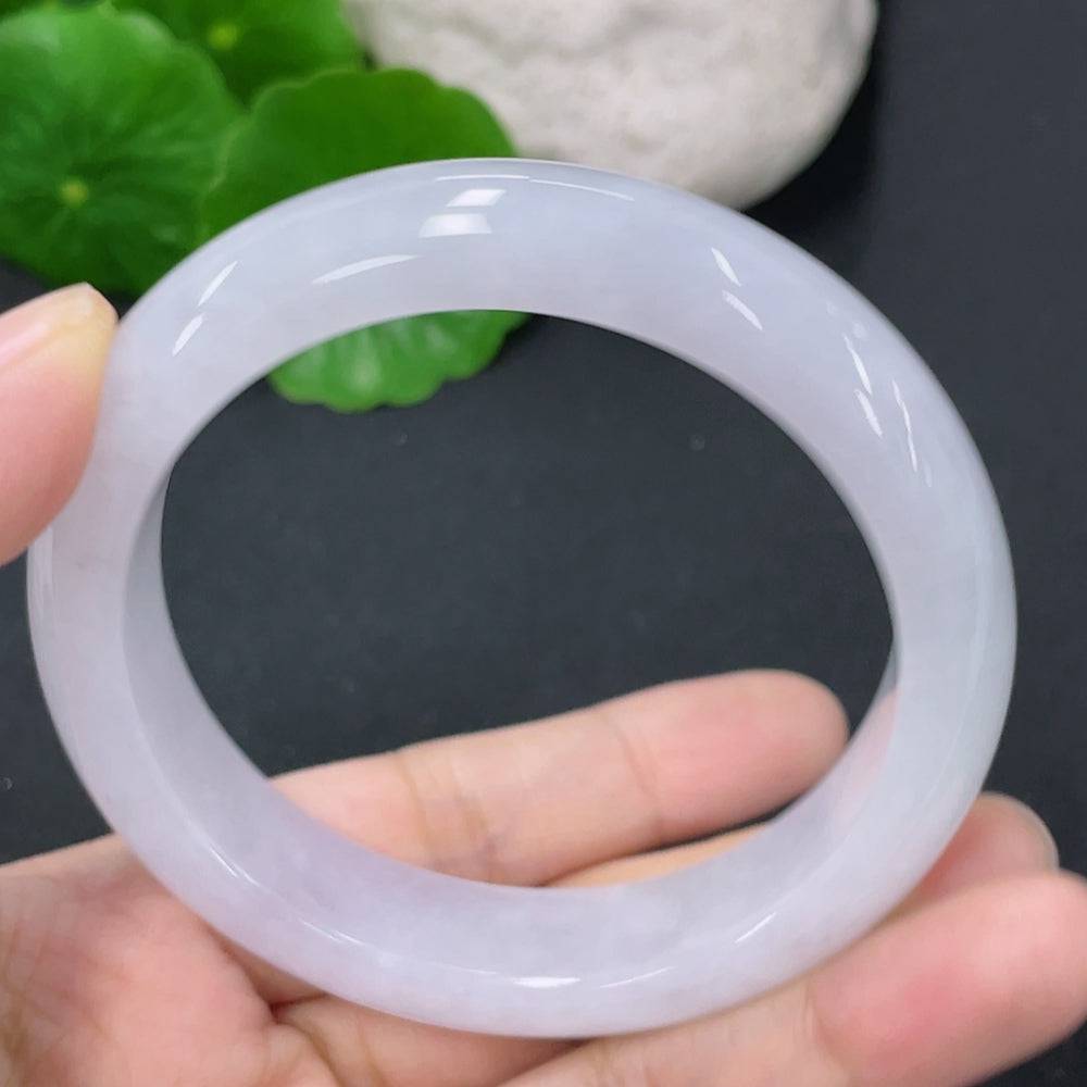 Huiliu Jadeite round bangle with smooth polished surface, crafted from authentic jade for elegant jewelry styling.