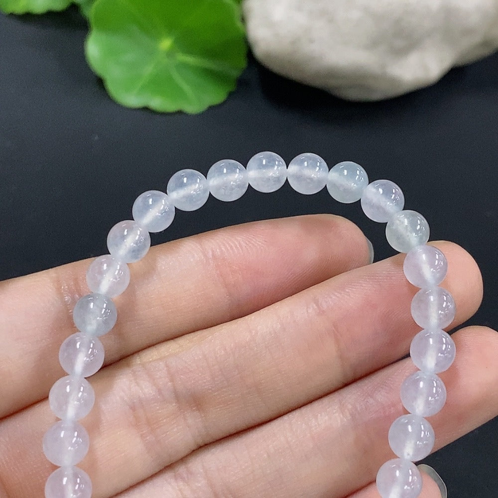 HKHQ jadeite bracelet, approximately 5.9mm wide, showcasing smooth, polished green jade stones with a total weight of 10.8g.