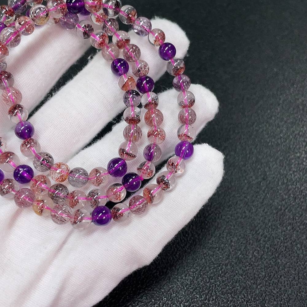 Huiliu certified gemstone crystal bead strand with 6.1mm size, featuring clear, polished crystal beads arranged in a continuous strand.