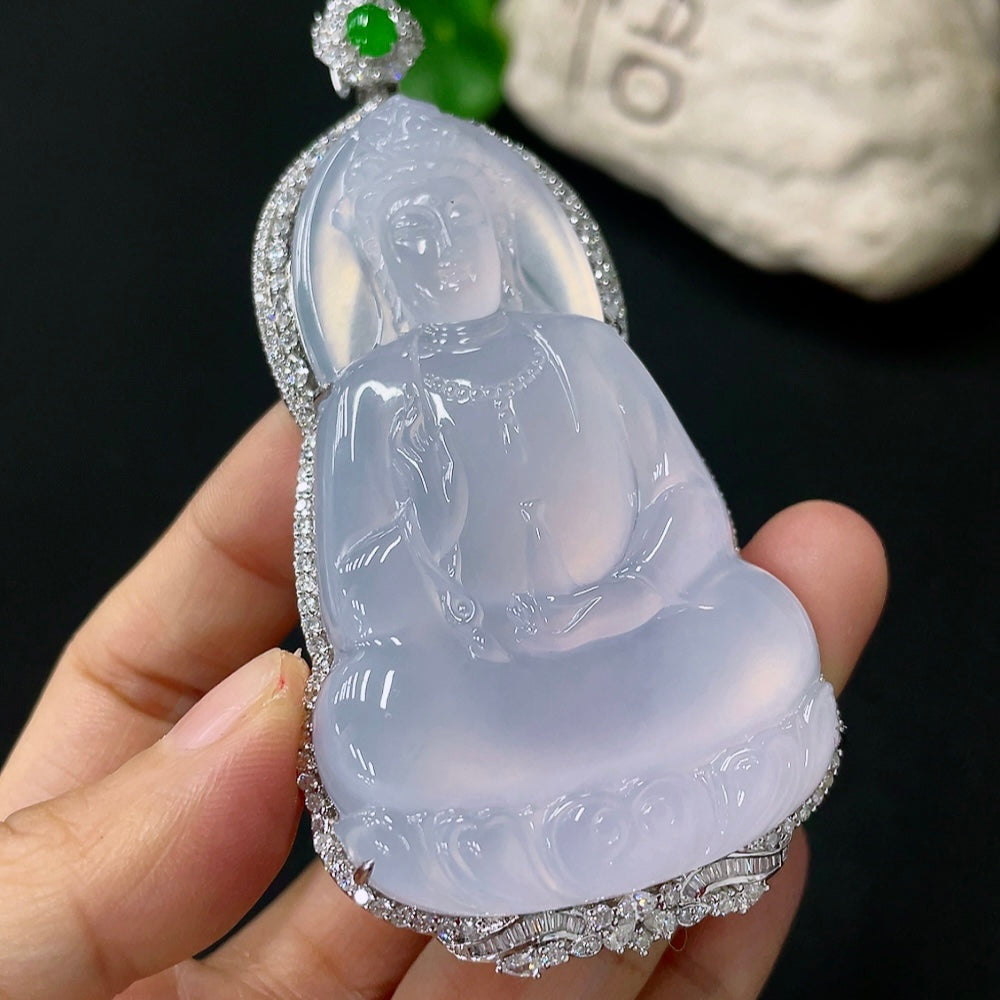 Jadeite inlaid Guanyin pendant with 18k gold and diamond accents, showcasing intricate craftsmanship and a serene figure.