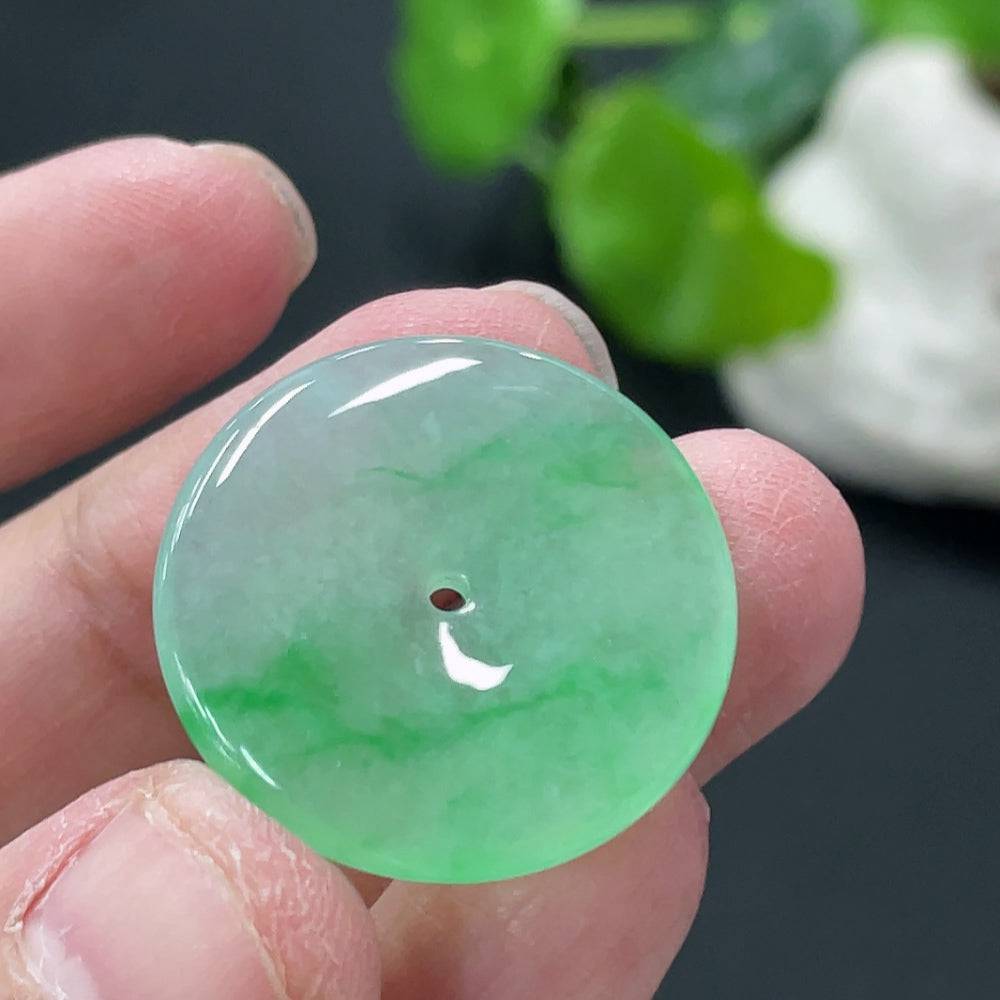 HUILIU HQ jadeite peace knot pendant, natural green jade jewelry, detailed close-up showing smooth polished surface and intricate design