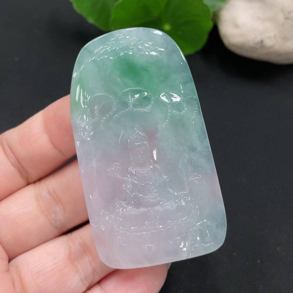 Jadeite Guanyin pendant from HUILIU HQ, showcasing a detailed carved figure with a smooth, polished jade surface.
