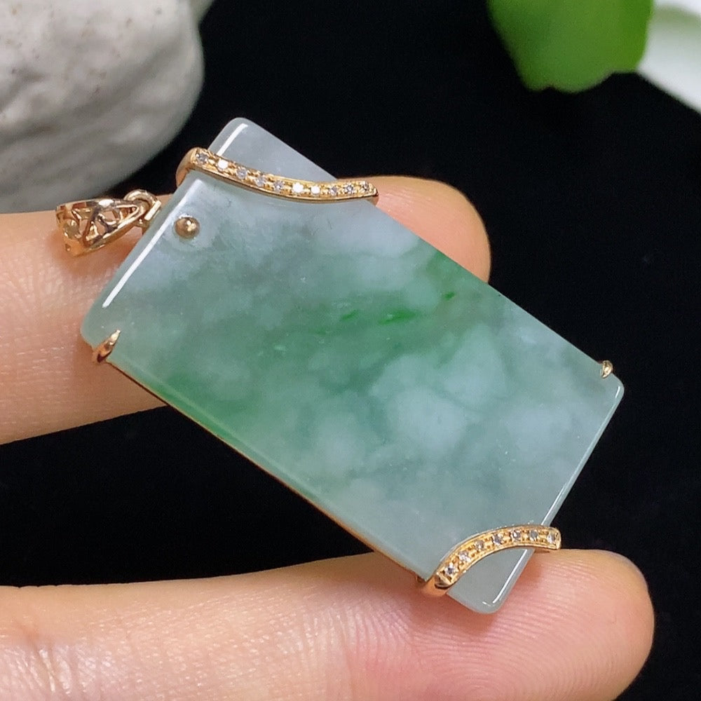 Jadeite plain pendant with 18K gold mounting and diamond accents, showcasing a polished jade gemstone with elegant design.