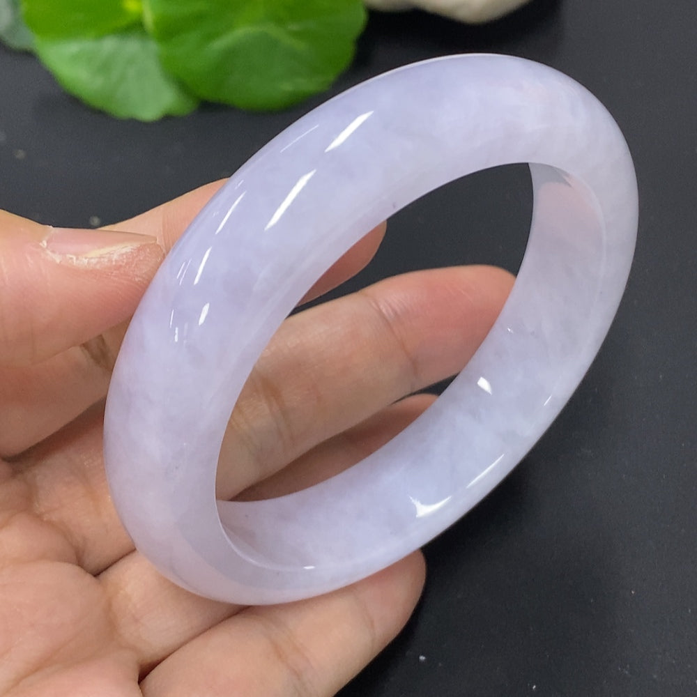 HKHQ jadeite round bangle, size 56.6, weighing approximately 67.5g, showcasing smooth, polished jadeite bracelet on a neutral background.