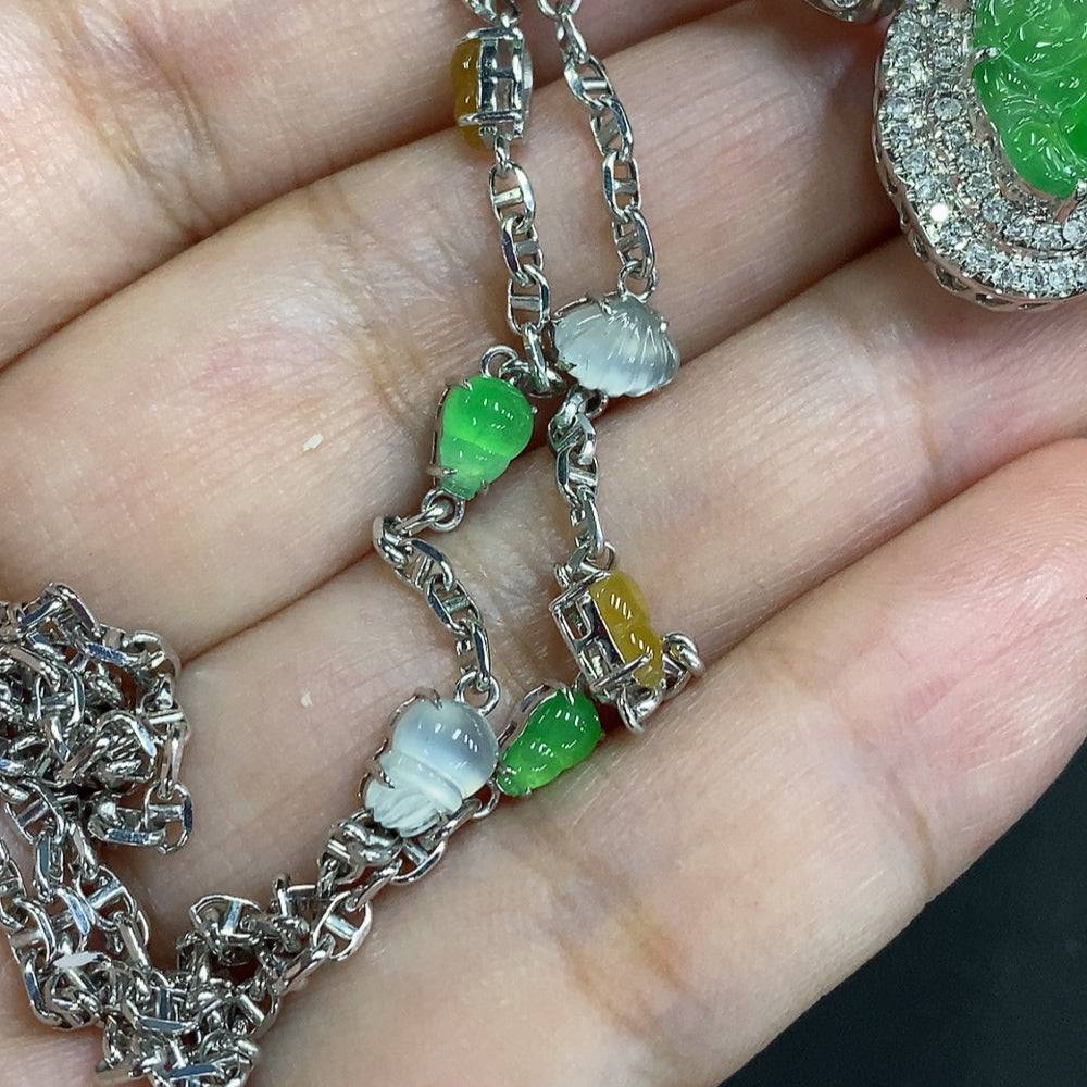 Jadeite Buddha pendant with 18K gold mount, accented with diamonds, attached to a chain, weight approx. 12.3g, by HUILIU HQ.