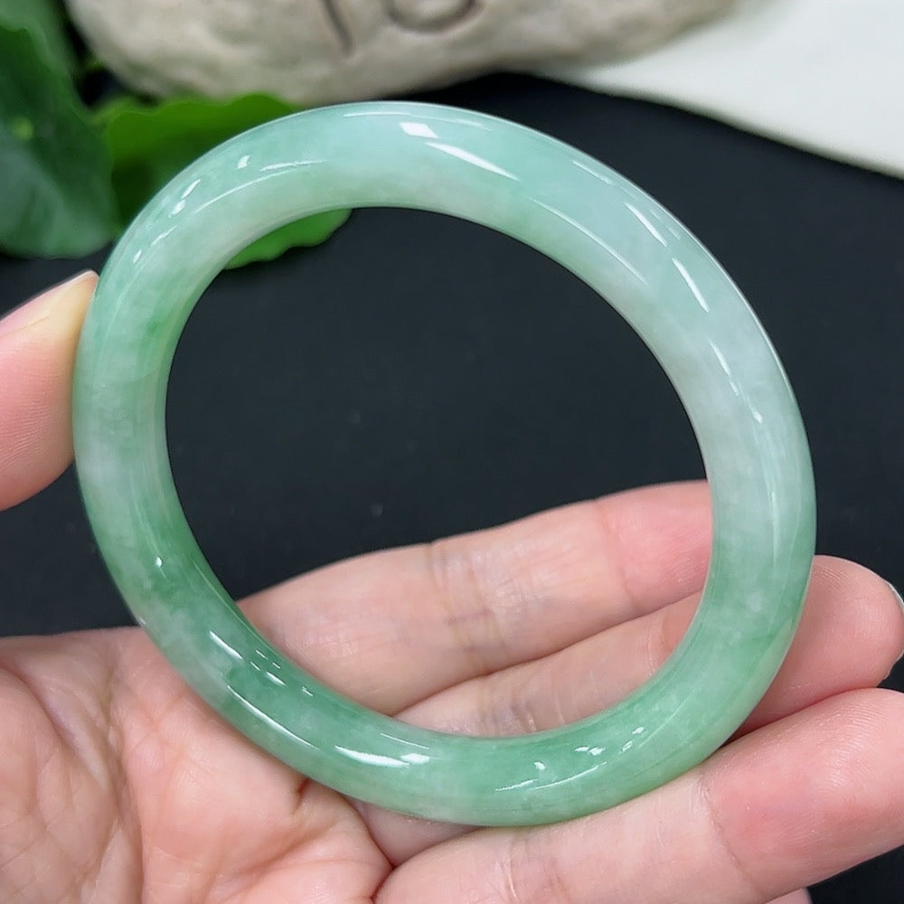 HKHQ jadeite round bangle size 56 with an approximate weight of 43g, showcasing smooth, polished jadeite surface.