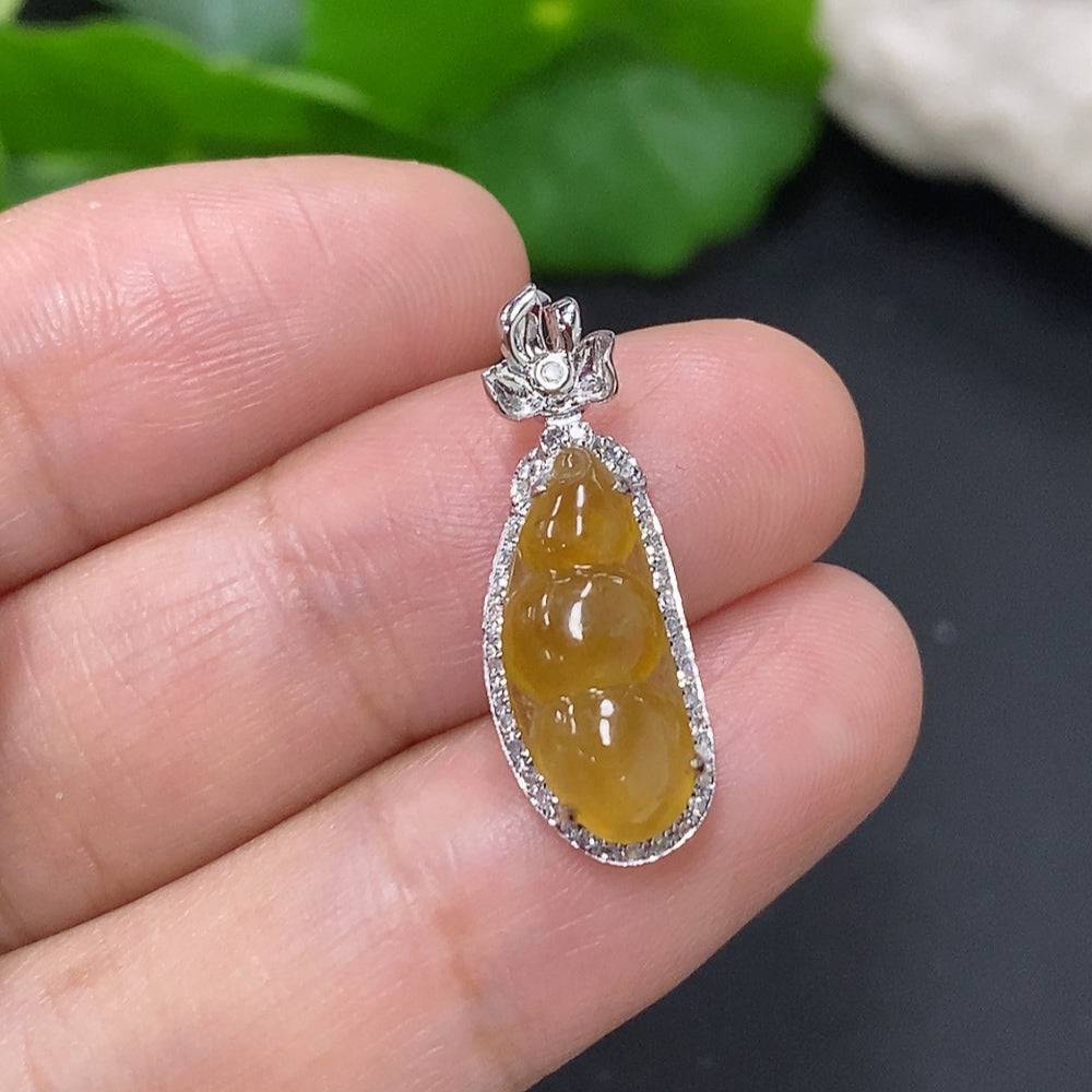 Jadeite blessing bean pendant in 18K gold with diamond accents, showcasing a smooth, polished jade jadeite gemstone with elegant design.