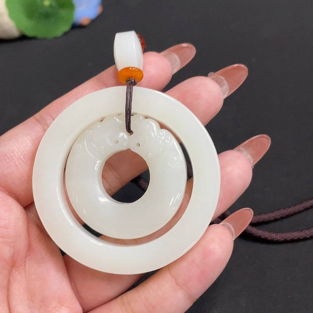Antique-style Hetian Jade pendant with beads, weighing approximately 55.4g, featuring a detailed carved design and attached rope.