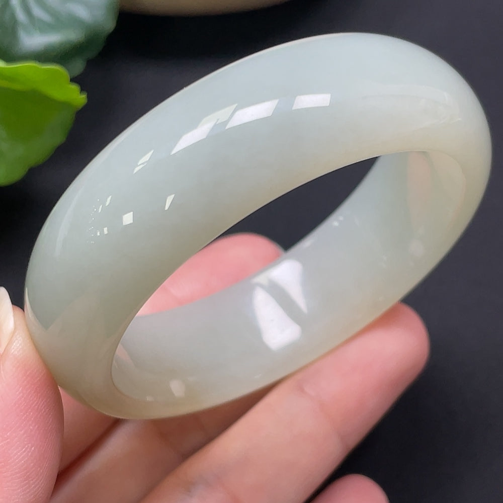 HKHQ Hetian Jade round bracelet, 52mm diameter, smooth polished surface, approximately 60.95g weight, showcasing fine jade craftsmanship.
