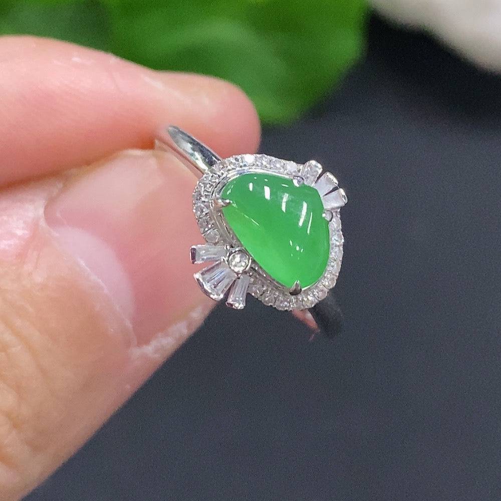 Huiliu Jadeite cabochon ring with diamond accents, featuring a polished green jade gemstone and intricate silver band.