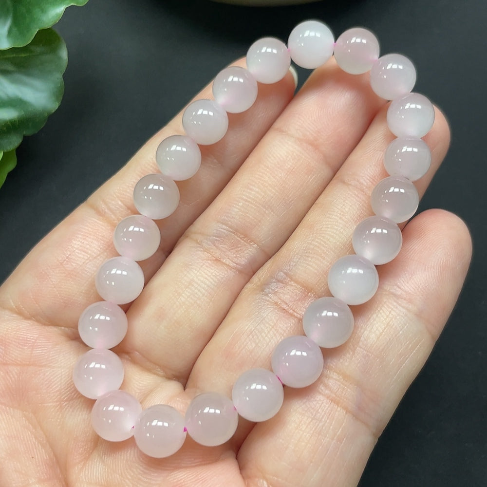 HKHQ Hetian Jade bracelet with 7.7mm beads, featuring smooth, polished green jade stones on a delicate bracelet.