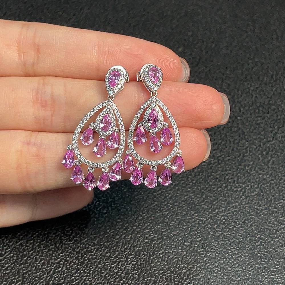 Huiliu Blue Sapphire gemstone earrings featuring vibrant blue sapphires set in a delicate jewelry design.