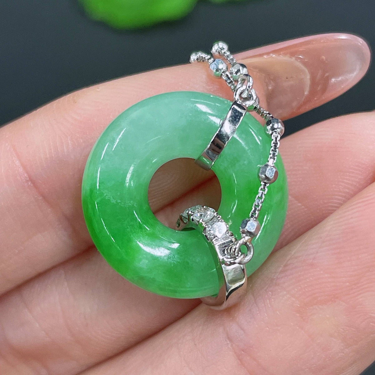 Jadeite pendant by HUILIU HQ with 18k gold inlay and diamond accents, weighing approximately 7.81 grams