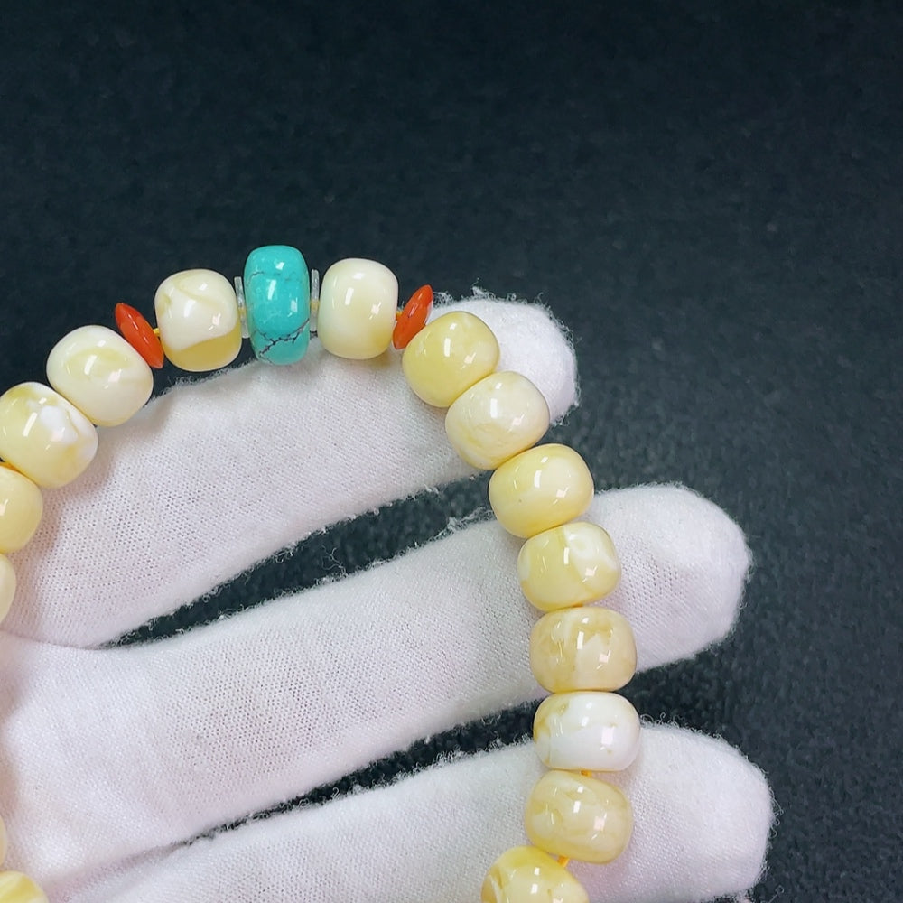 Amber Beeswax Bracelet with Hetian Jade (stone setting may be non-natural), total weight approx. 16.52g, size about 10mm