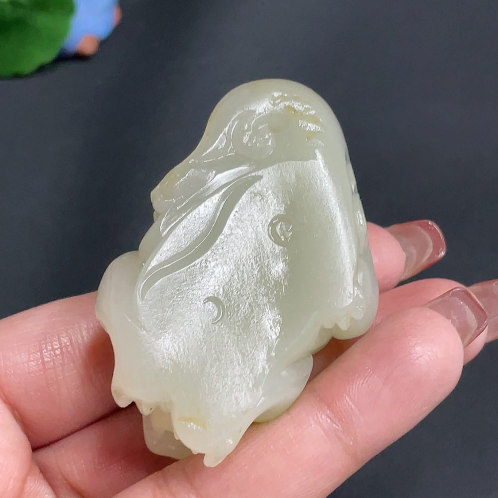 Huiliu-certified Hetian jade pendant featuring an auspicious beast design, undetermined skin color, natural jade finish.