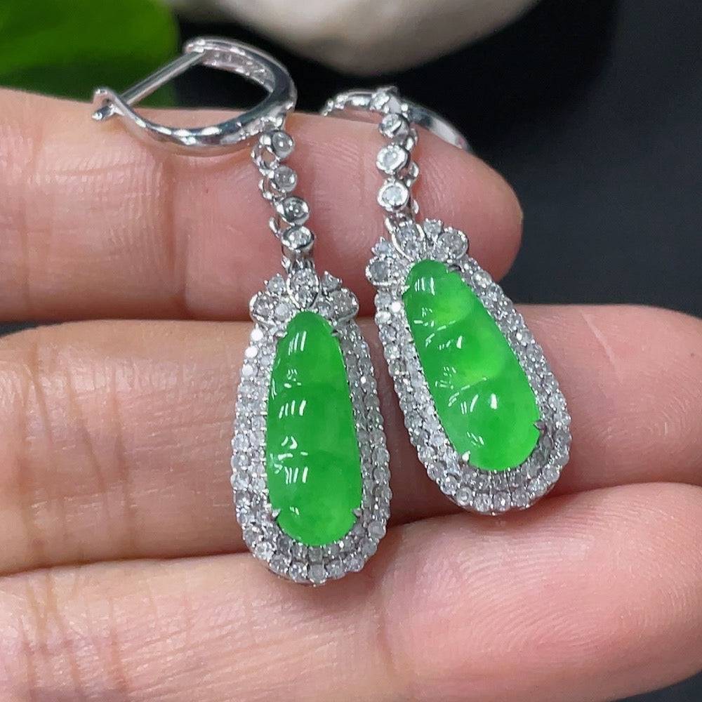 Jadeite earrings with 18k gold and diamond accents, showcasing smooth jade stones and elegant gold hooks.