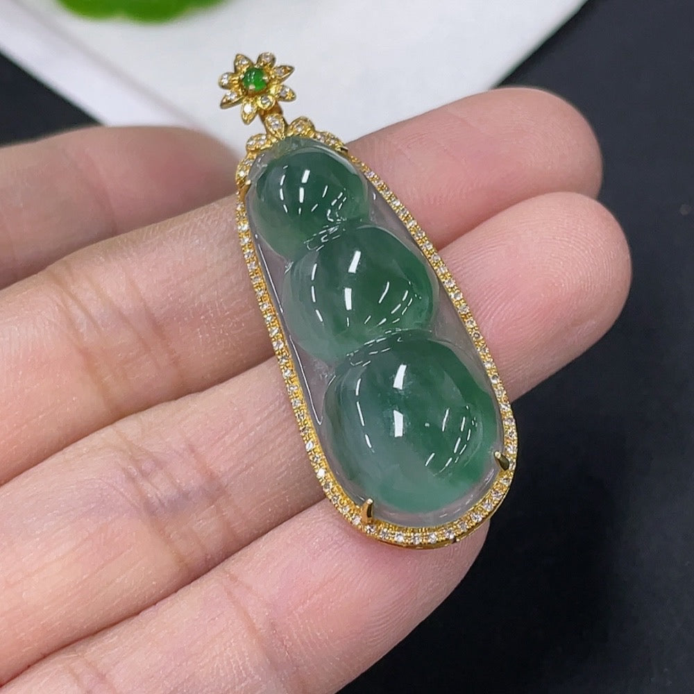 Huiliu Jadeite lucky bean pendant with diamond accents, featuring intricate inlay and polished jade surface.