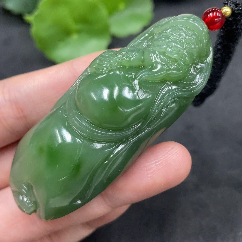 Hetian jade pendant featuring the God of Wealth, weight 67.4g including rope, crafted by HUILIU HQ, detailed jade carving visible.