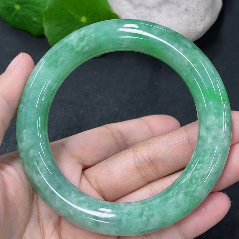 Jadeite round bangle with a 55.5mm diameter, weight approx. 77g, showcasing smooth, polished jade surface and vibrant green color.