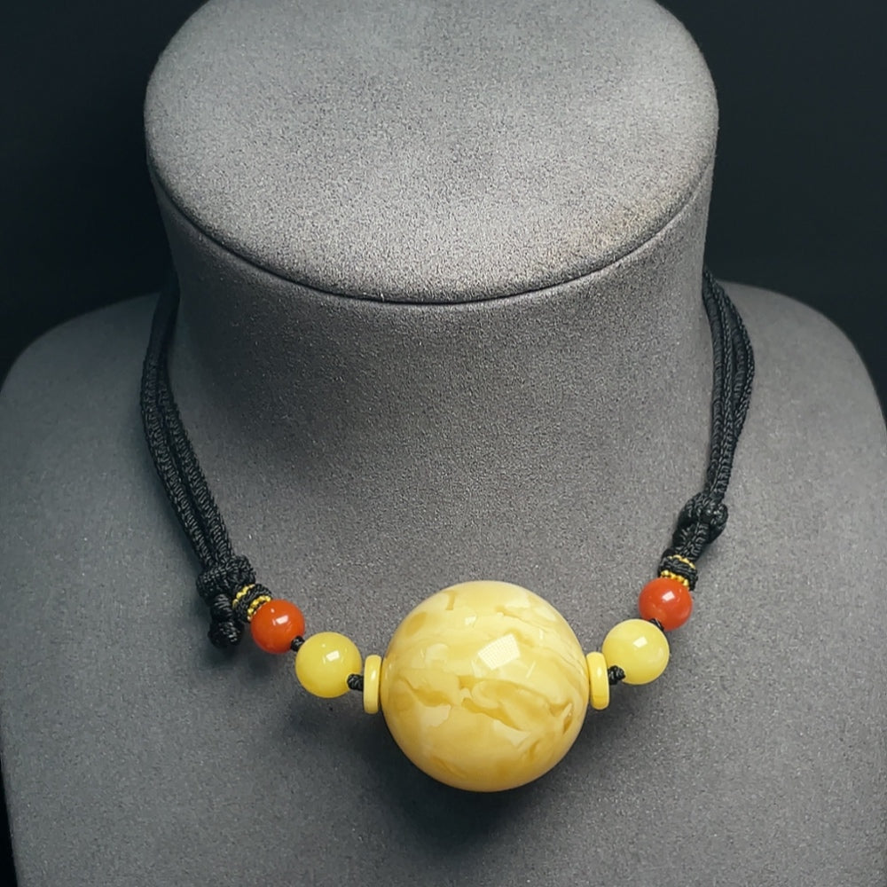 Amber beeswax pendant with Southern Red Agate, 33mm size, HUILIU HQ certified, featuring a natural amber pendant with rope.