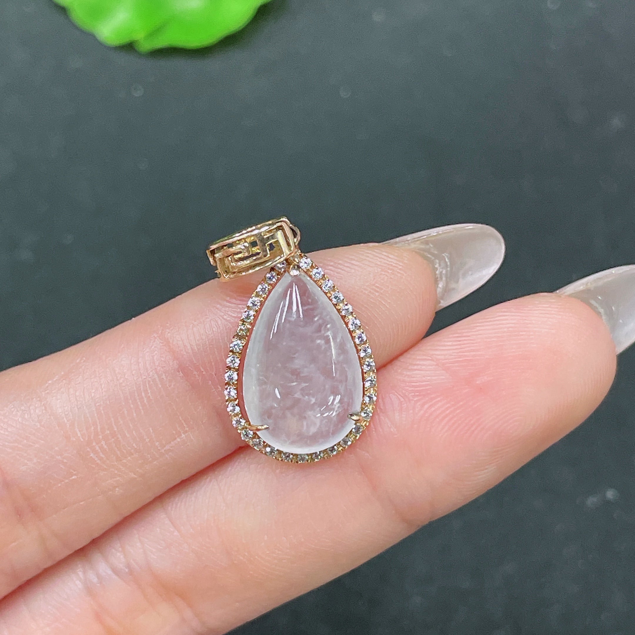 Huiliu Jadeite teardrop inlay pendant featuring smooth jade surface and elegant design, certified by HUILIU HQ