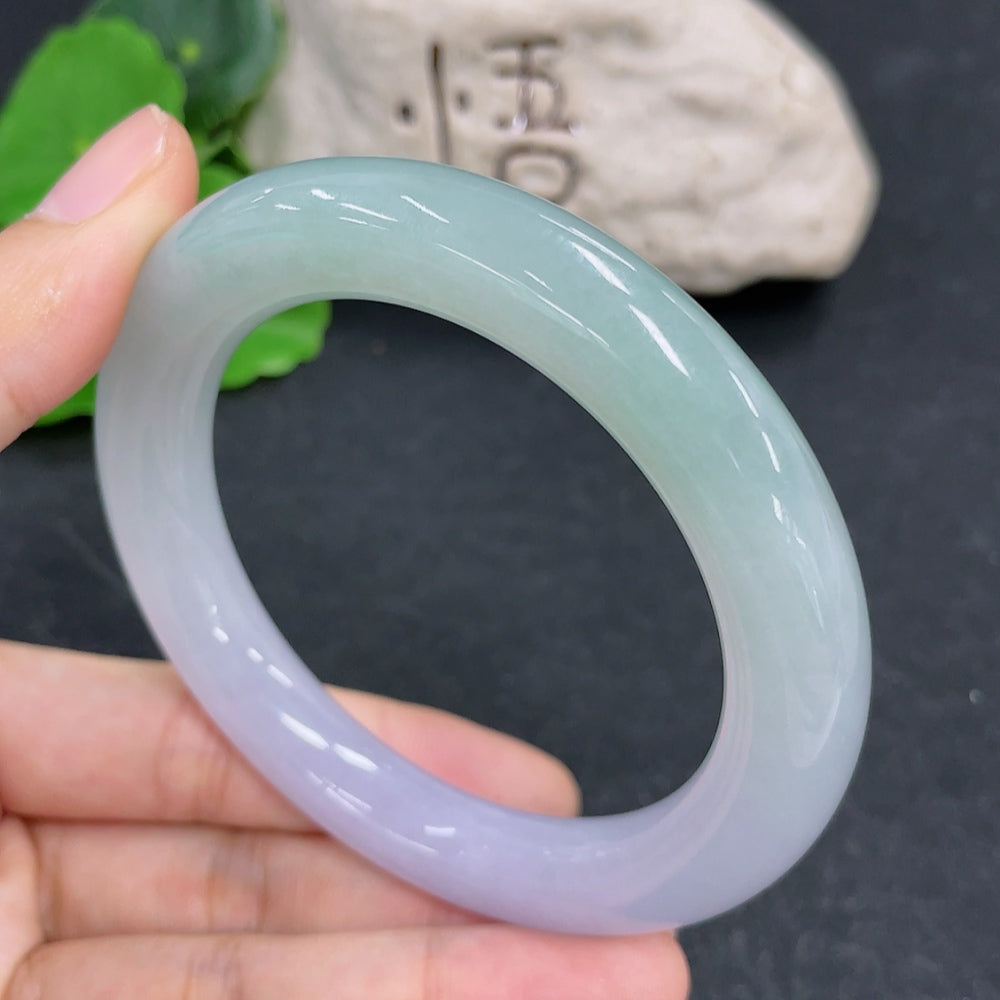 HKHQ jadeite round bangle, size 57.1, weighing 70.28g, showcasing smooth, polished jadeite in a circular bracelet design.