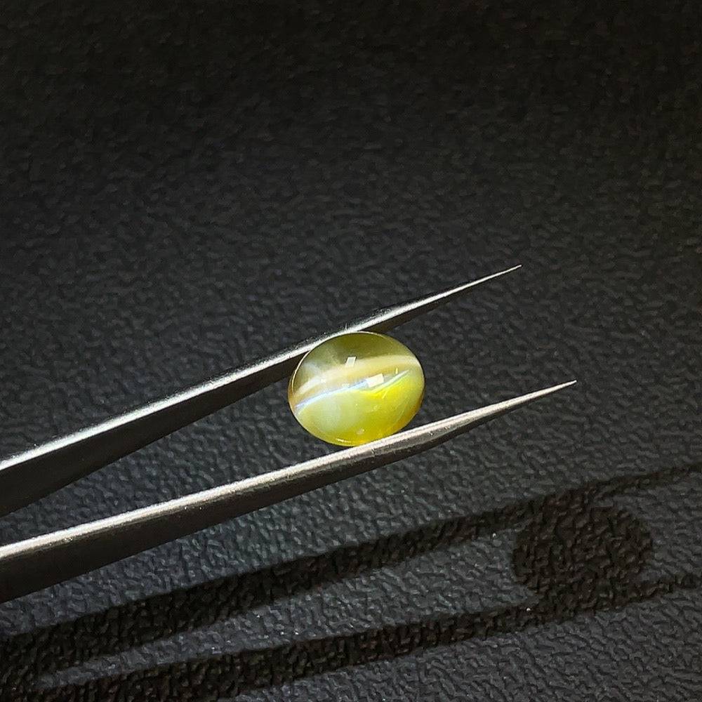 Huiliu certified Chrysoberyl loose gemstone, 6.96 carats, showcasing its vibrant color and clarity.