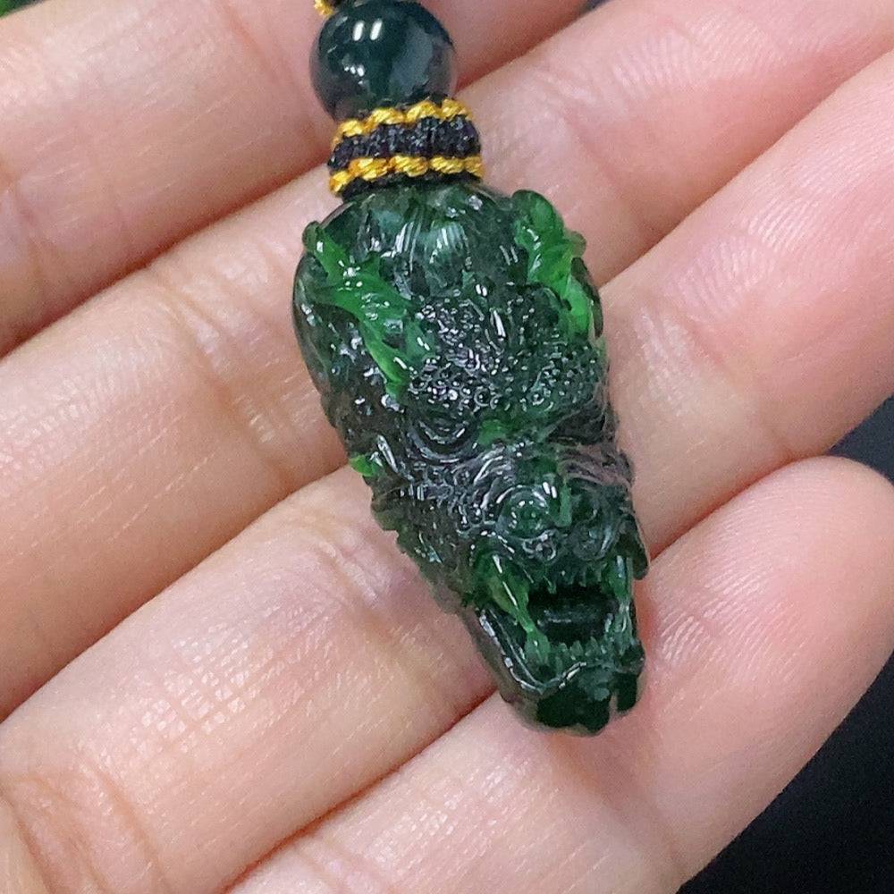 Huiliu Jadeite pendant featuring a dragon plaque with rope, crafted from green jade for traditional jewelry or display.