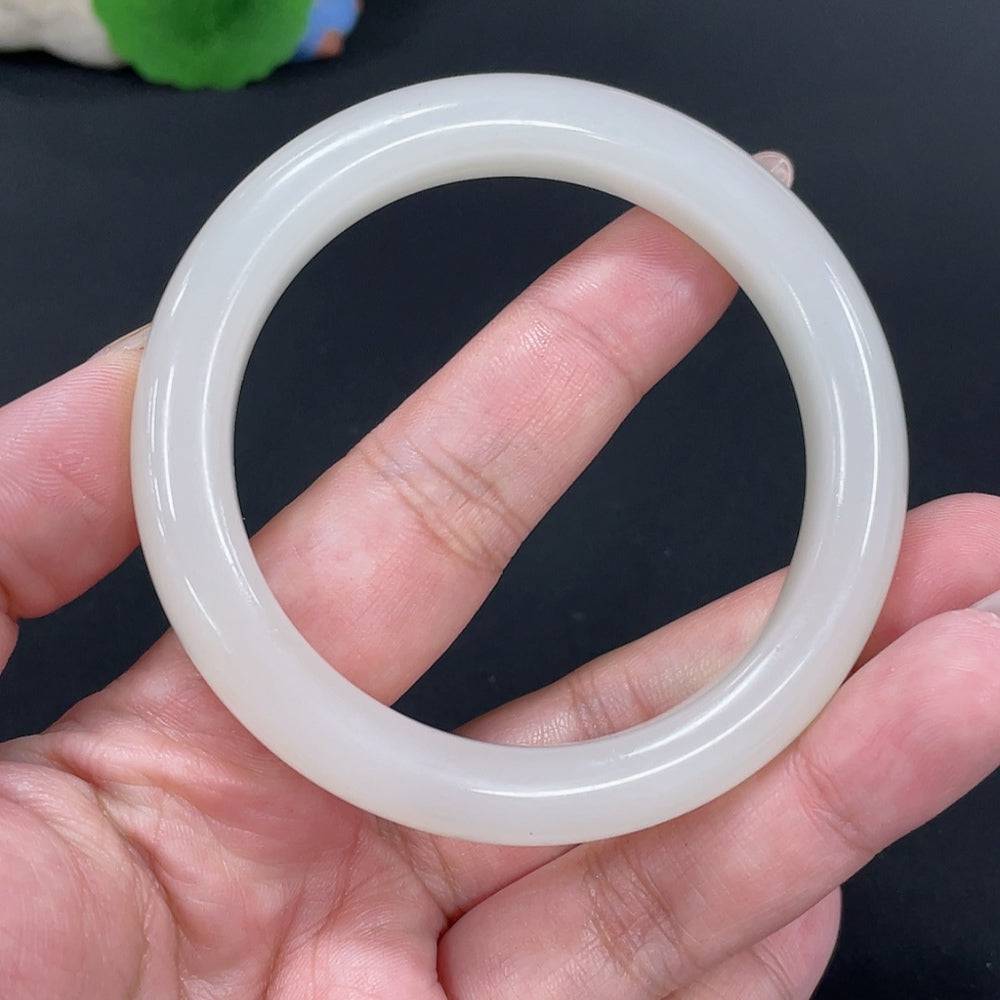 Huiliu certified Hetian Jade round bracelet featuring smooth, polished jade beads on a delicate string.